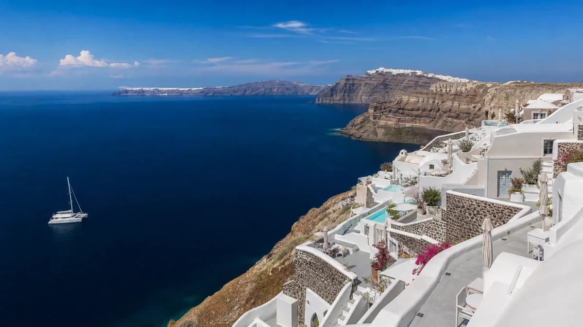 Cruising catamaran near a Mediterranean island